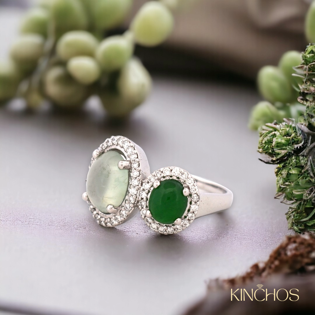 Kinchos dual jadeite toi et moi ring — flat lay on stone surface